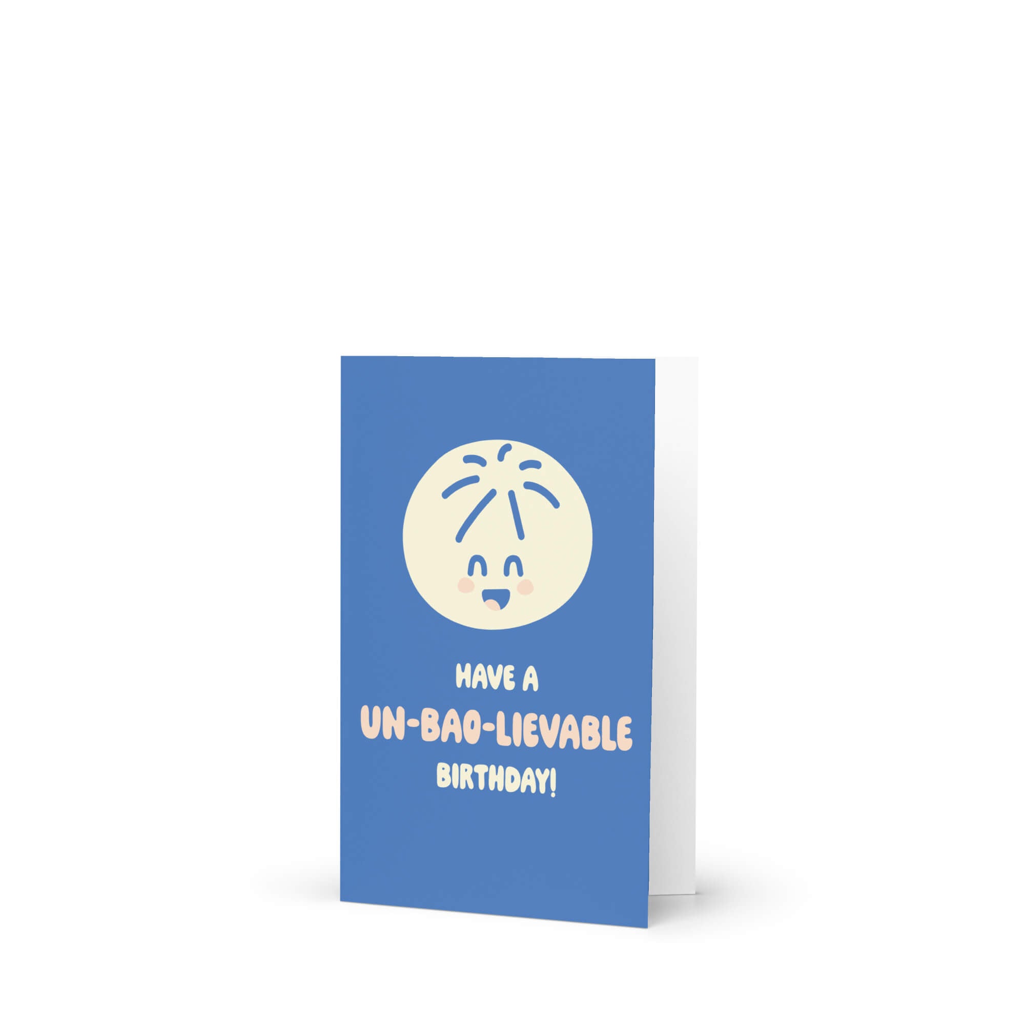 Blue birthday card with a white smiley face and text on a white background