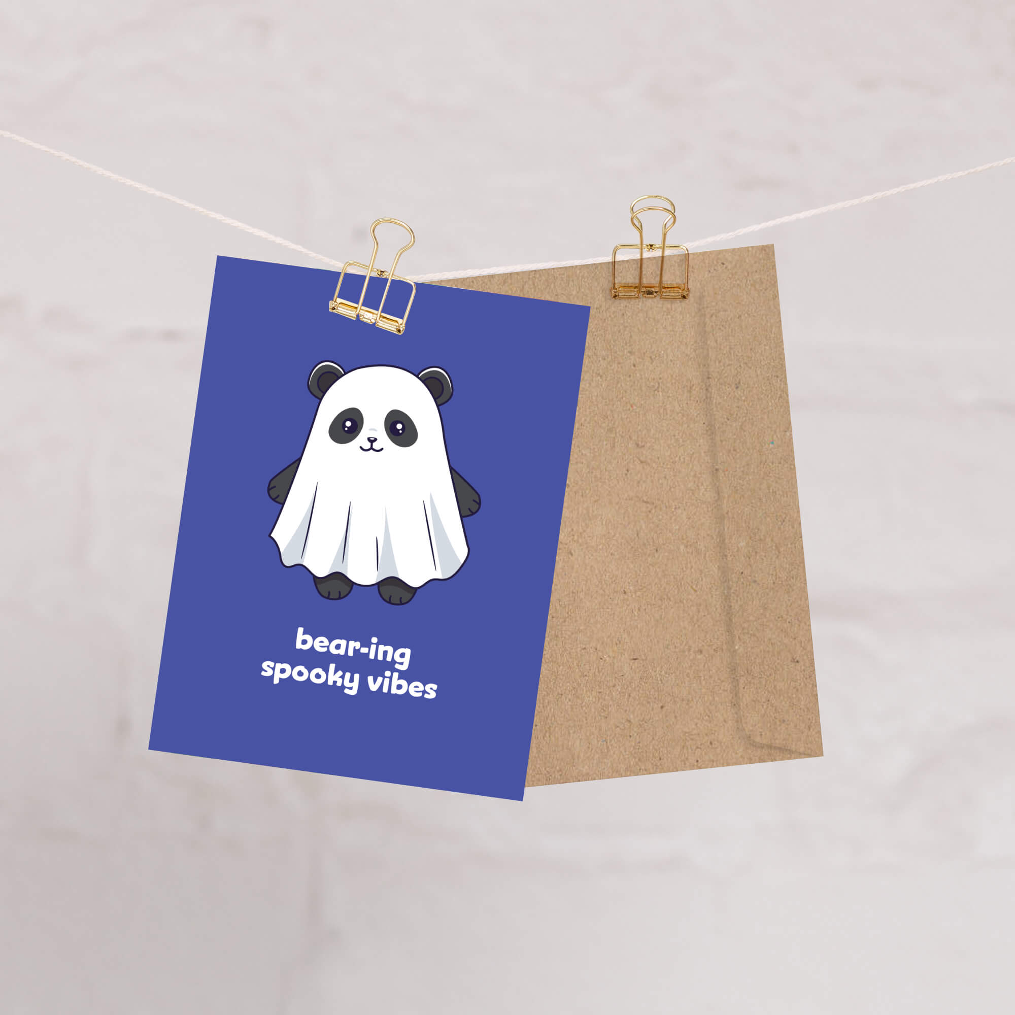 kawaii halloween Greeting card with a panda bear ghost illustration and text on a blue background