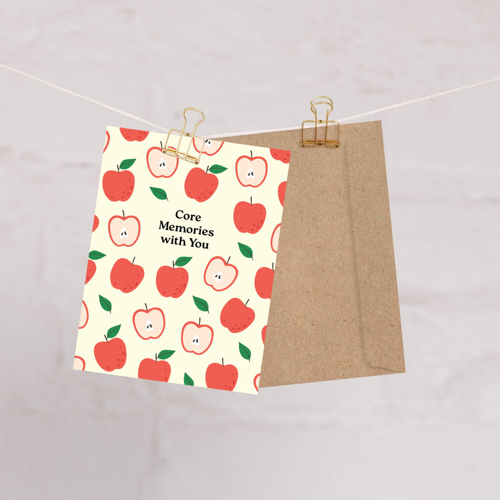 asian Greeting card with red apples pattern and 'Core Memories with You' text on a beige background