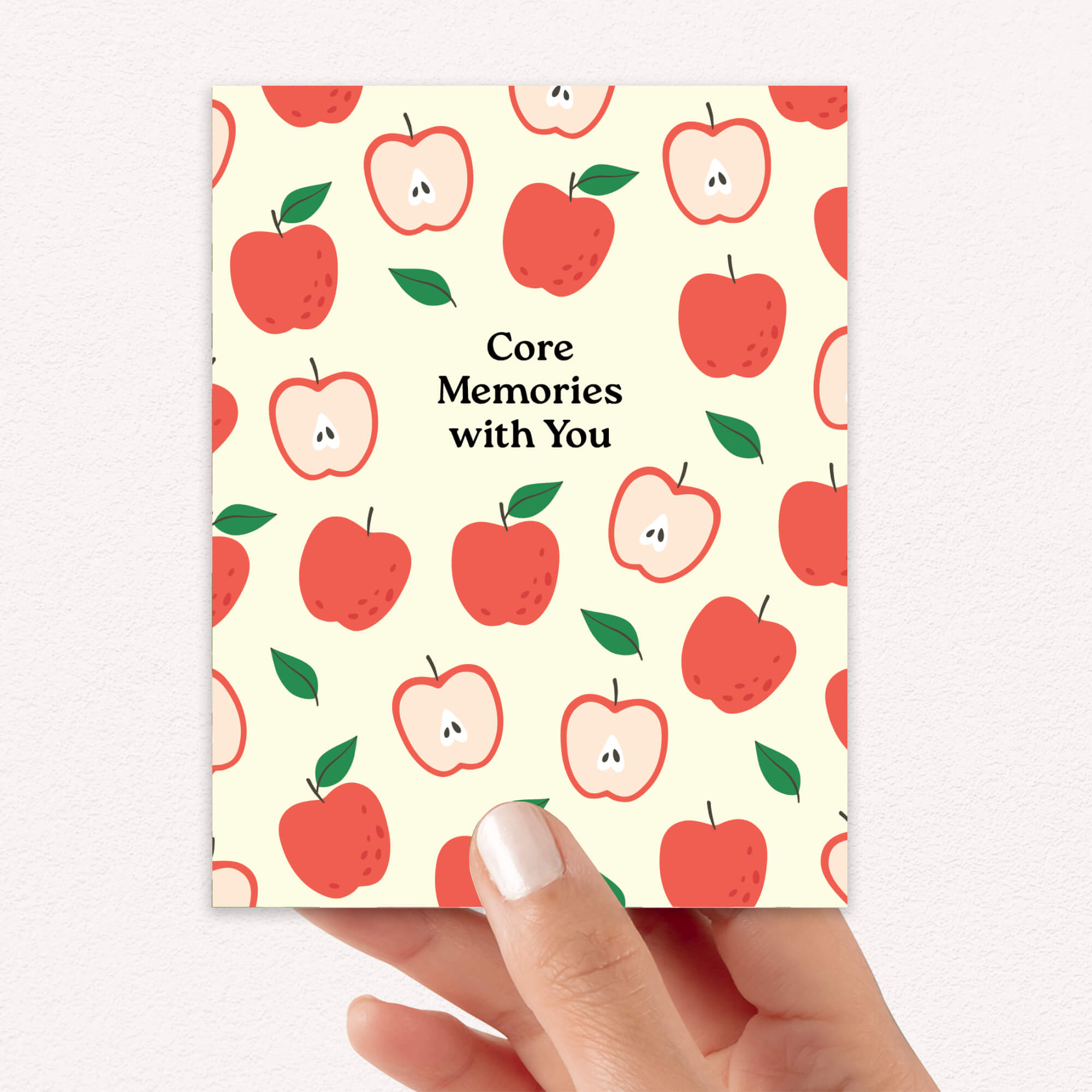 asian Greeting card with red apples pattern and 'Core Memories with You' text on a beige background