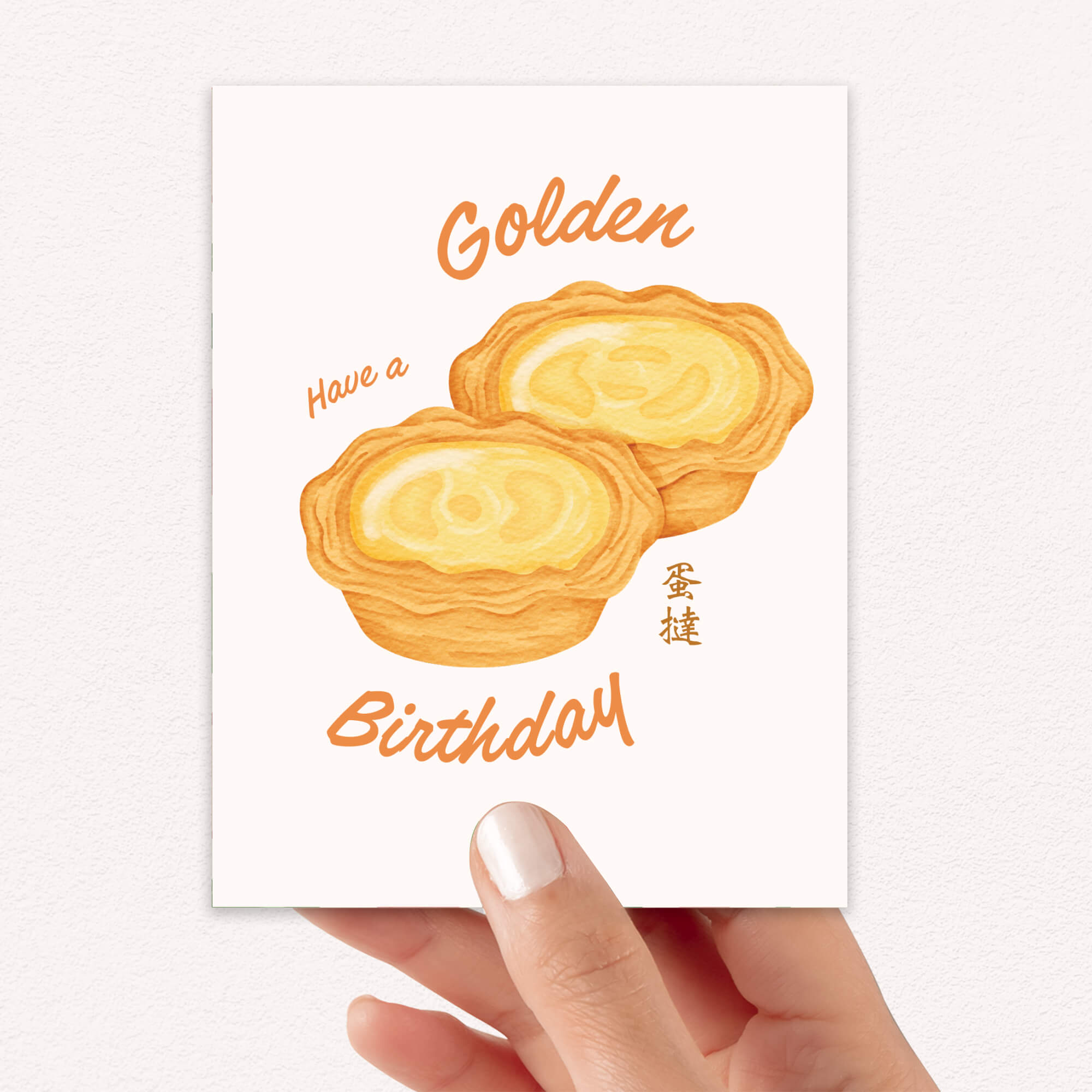 asian birthday Greeting card with two golden egg tart pastries and 'Have a Golden Birthday' text on a white background.