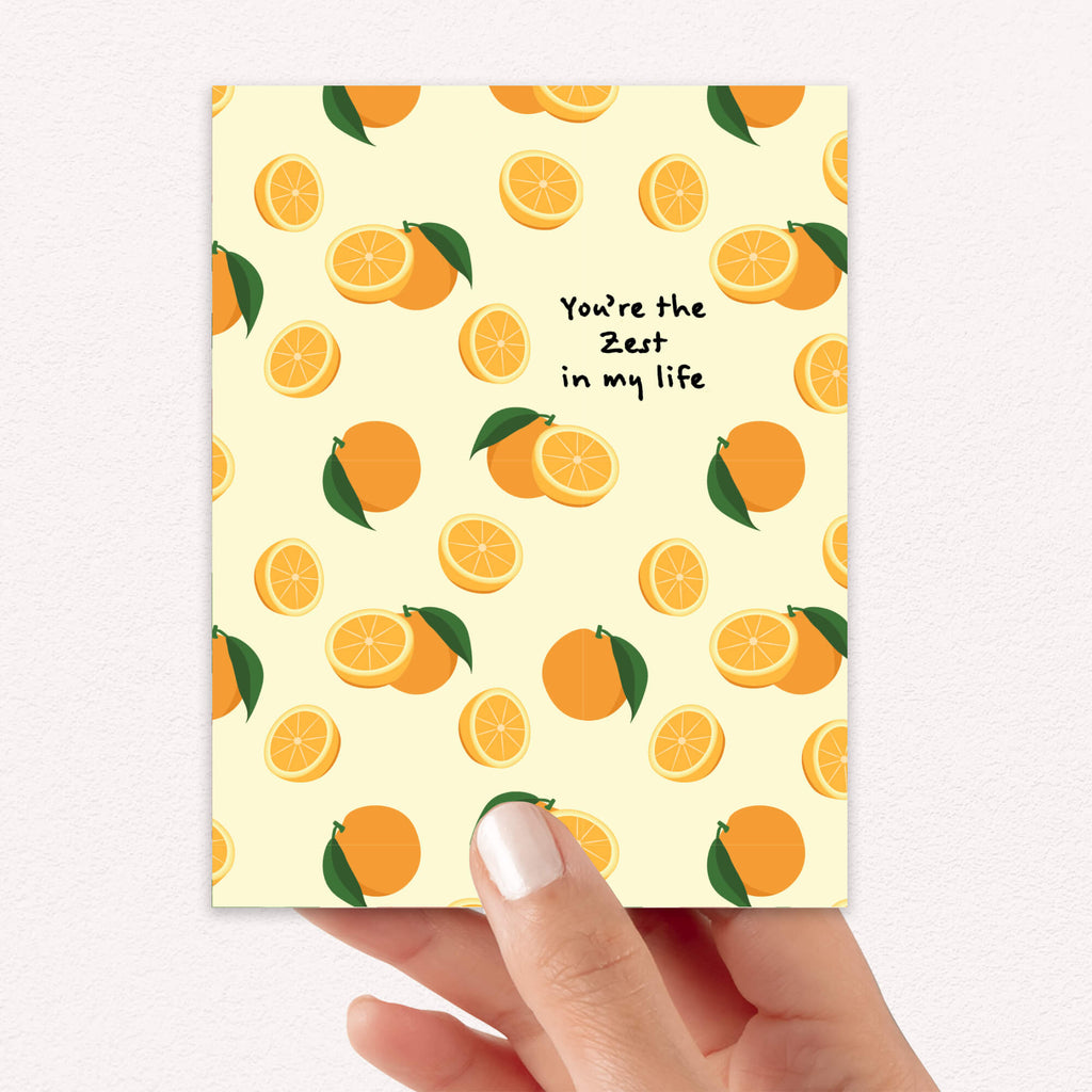 asian Greeting card with orange pattern and text 'You're the zest in my life' on a beige background.