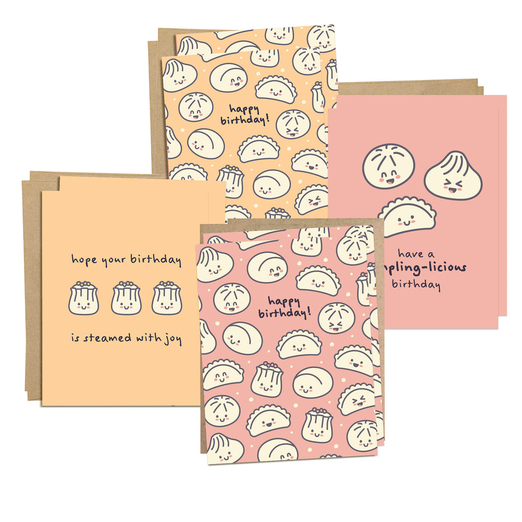 boxed Set of four birthday cards with dumpling illustrations on a white background