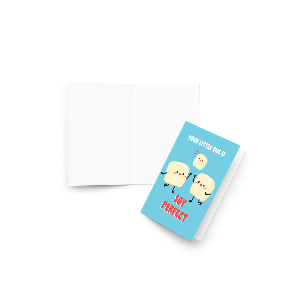 A folded baby shower card with a light blue front featuring three cartoon tofus and the text 'YOUR LITTLE ONE IS JOY PERFECT' in white and red, shown next to an open blank white card on a white background.
