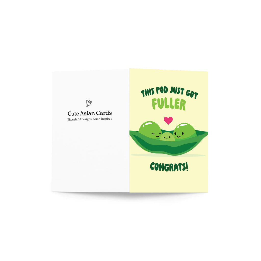 A folded new baby shower card shown on a white background. The right panel has a pale yellow background with the text 'THIS POD JUST GOT FULLER CONGRATS!' and a cute illustration of two green peas hugging under a small pink heart.