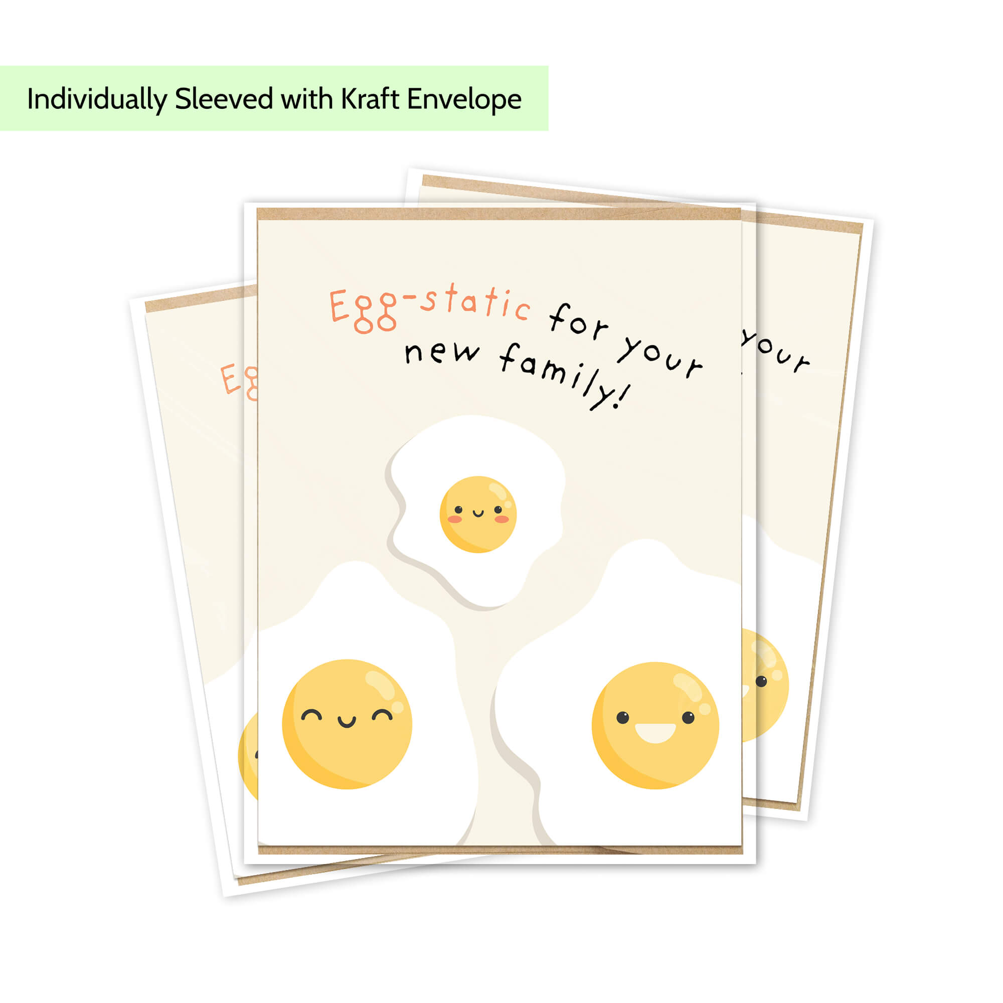 A stack of greeting cards with a cute egg-themed design, shown on a white background with a light green text banner at the top that reads 'Individually Sleeved with Kraft Envelope'. The cards feature smiling cartoon fried eggs and the phrase 'Egg-static for your new family!'.