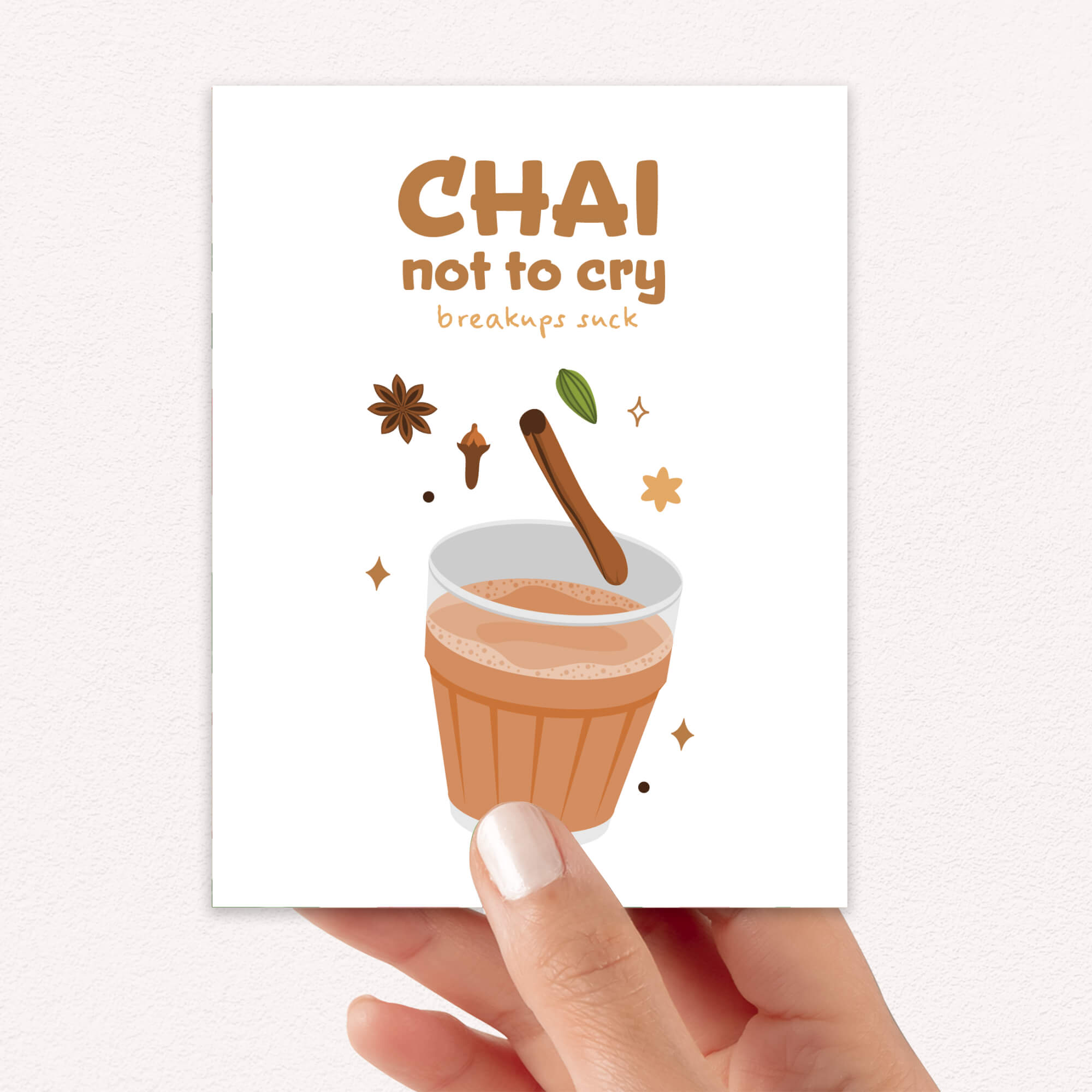 divorce Card with a illustration of chai tea and text 'Chai not to cry breakups suck' held by a hand.