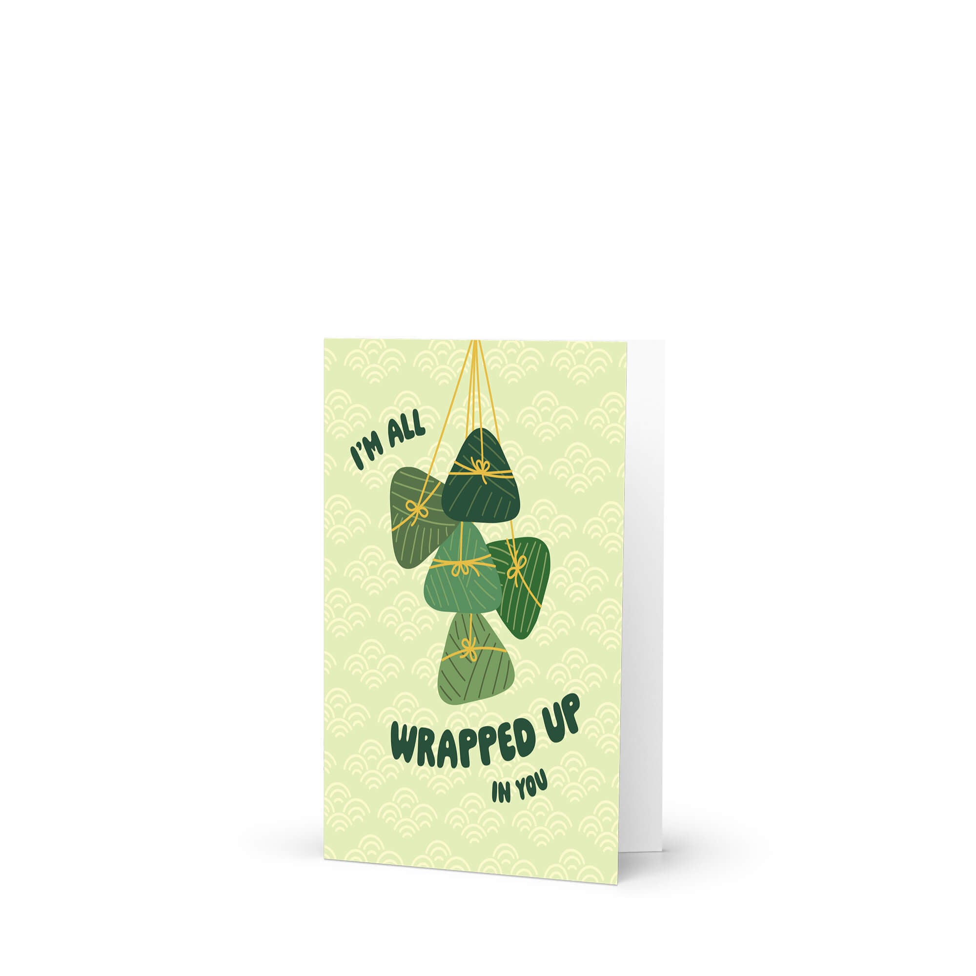 Greeting card with green banana leaf zong zi chinese tamale illustrations and text on a light green background dragon boat festival