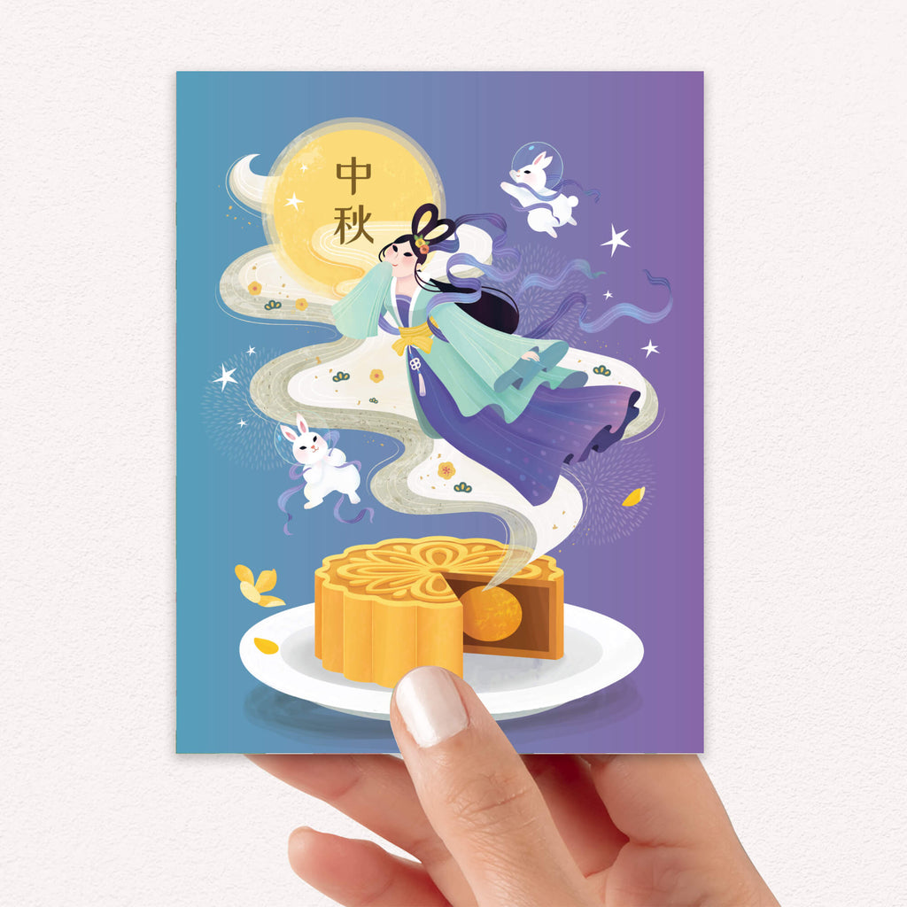 asian greeting Card with illustration of a goddess Chang E, white jade rabbits, osmanthus flowers, and mooncake, held by a hand on a white background 