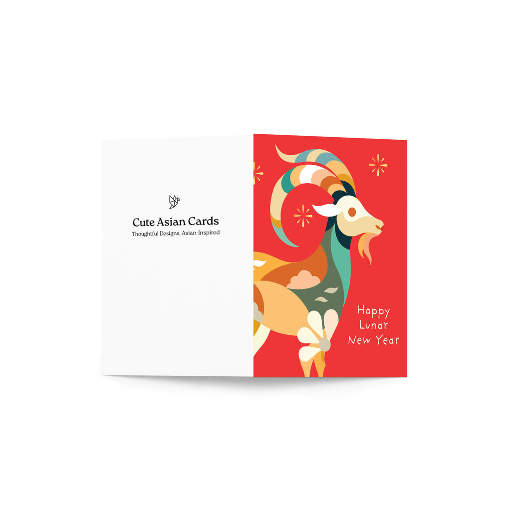 A year of the goat card shown open against a white background. The left panel is white with the text 'Cute Asian Cards' and a small logo, while the right panel features a colorful stylized ram illustration on a red background with the words 'Happy Lunar New Year'.