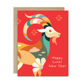 A Lunar New Year greeting card featuring a stylized ram illustration on a bright red background, with the text 'Happy Lunar New Year' in white. A kraft paper envelope is placed behind the card against a clean white background.