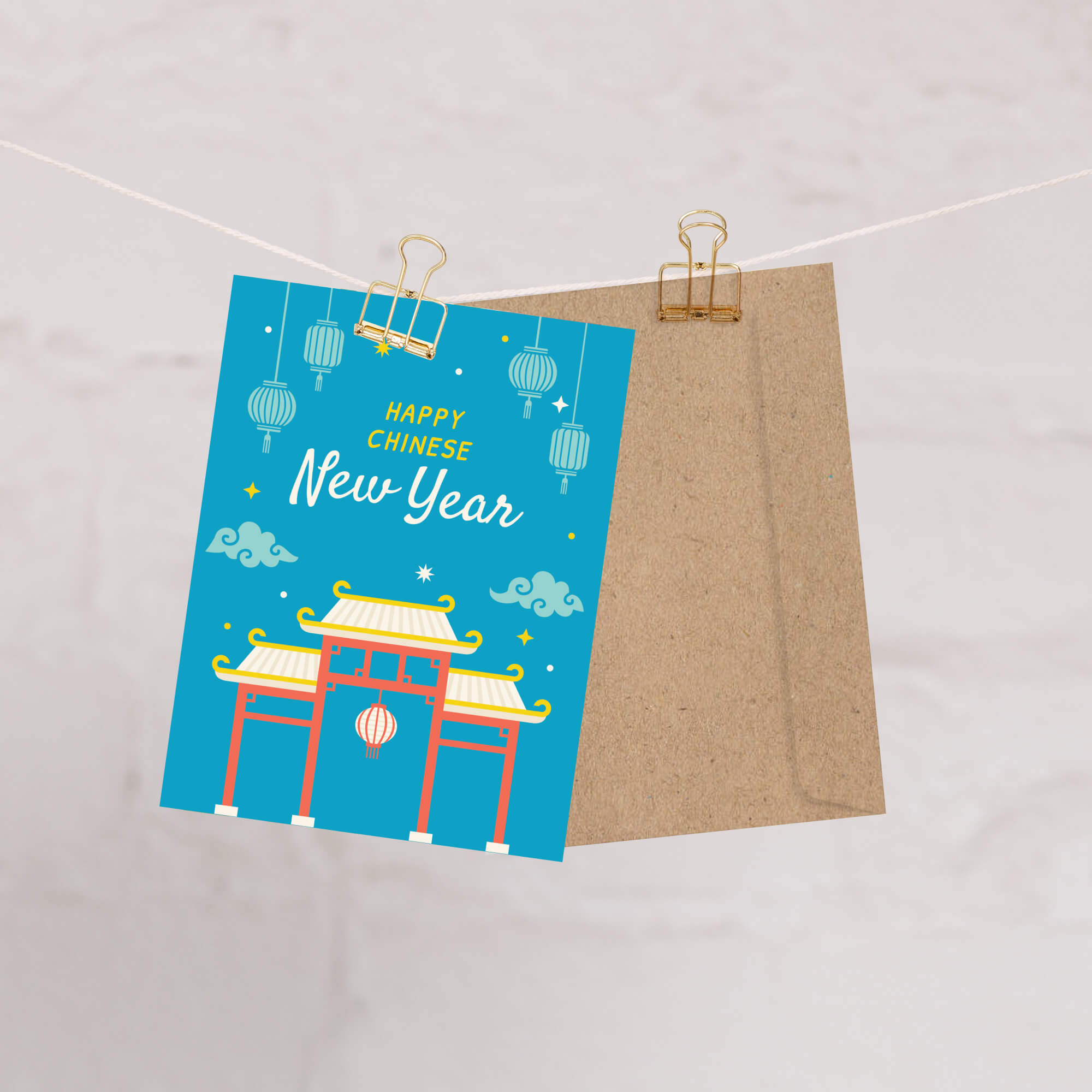 Greeting card with 'Happy Chinese New Year' text and traditional gate design, hanging on a string.