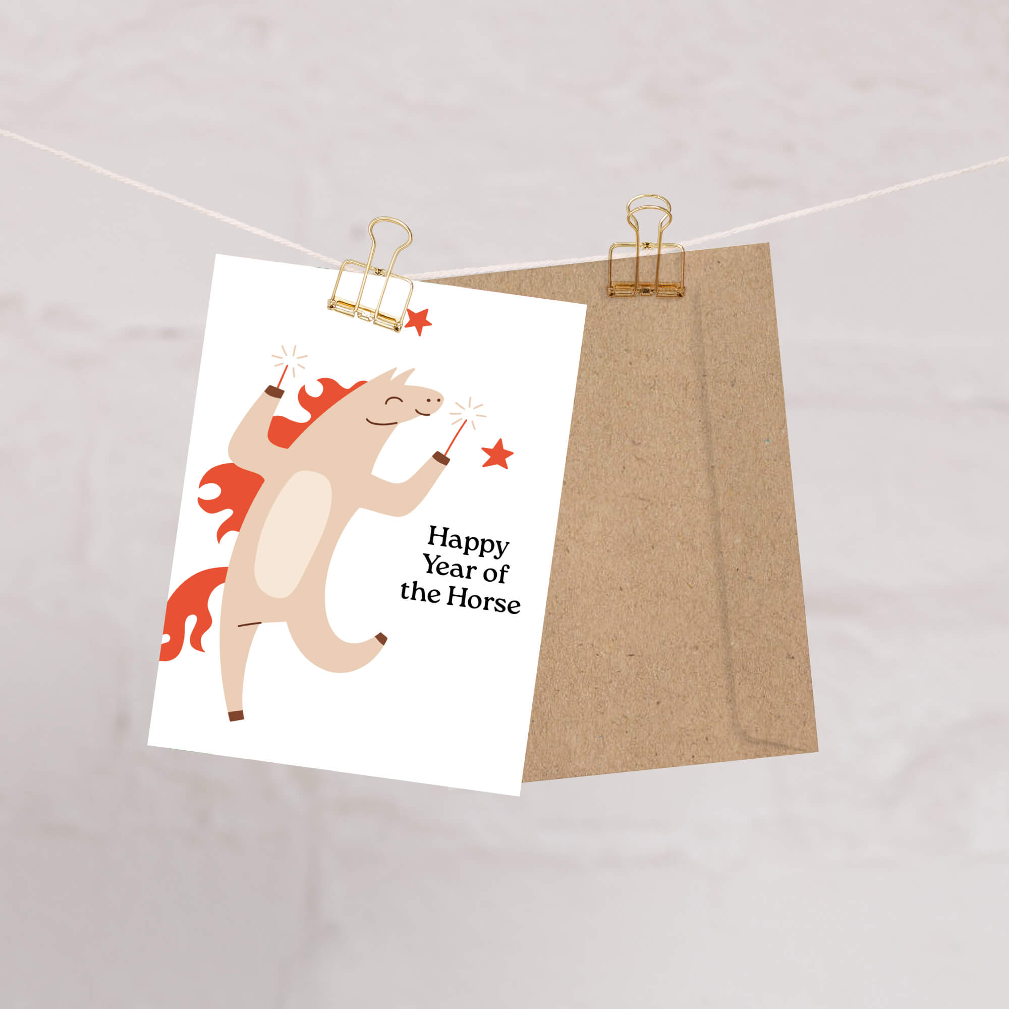 Card with horse illustration and 'Happy Year of the Horse' text, attached to a string with a paper clip.