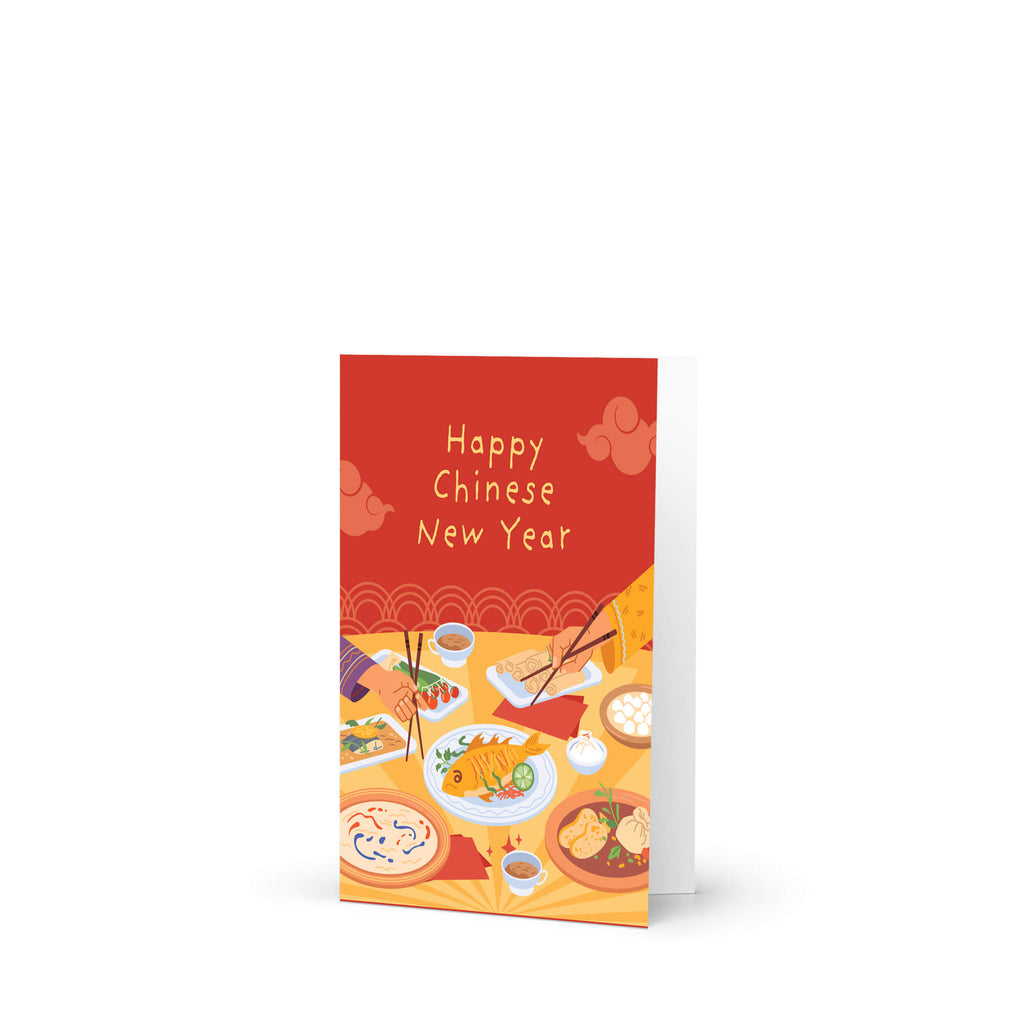 A red and orange Chinese New Year greeting card with 'Happy Chinese New Year' written in white text, standing upright on a white surface against a white background.