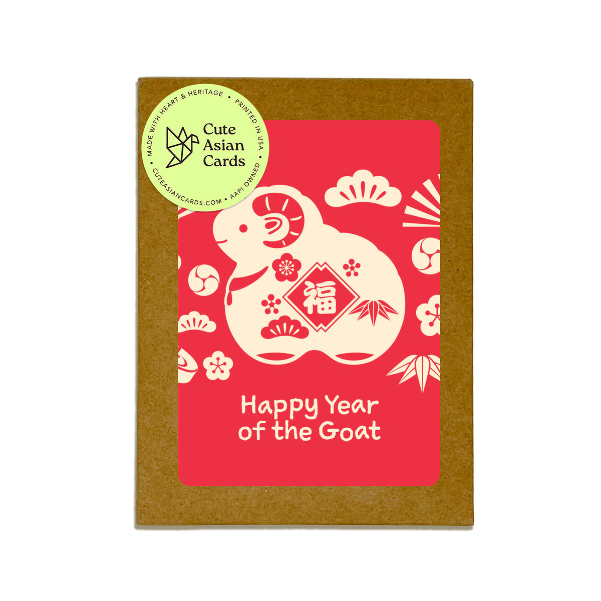 assorted box set of chinese new year cards for 2027 in a brown kraft pack, featuring a red front with a cream-colored goat illustration and the text 'Happy Year of the Goat.' A round green sticker on the top left reads 'Cute Asian Cards' and includes the website clearcards.
