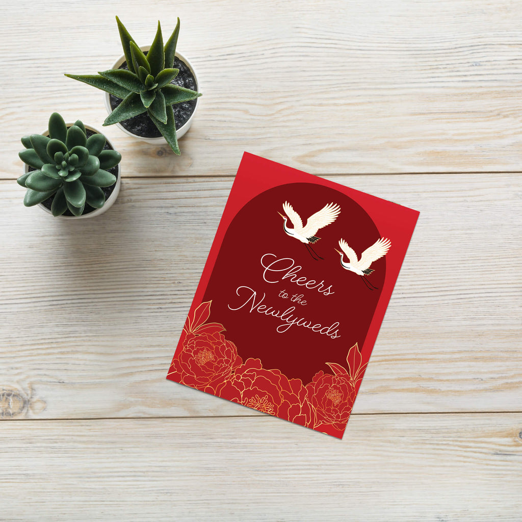 asian wedding Greeting card with cranes and floral design on a red background