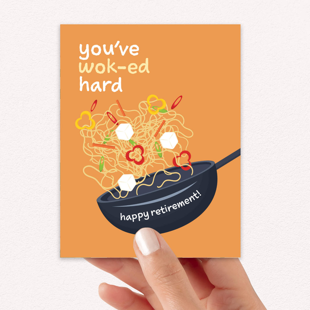 retirement card with a wok and noodles design, text 'you've wok-ed hard happy retirement!', on an orange background.
