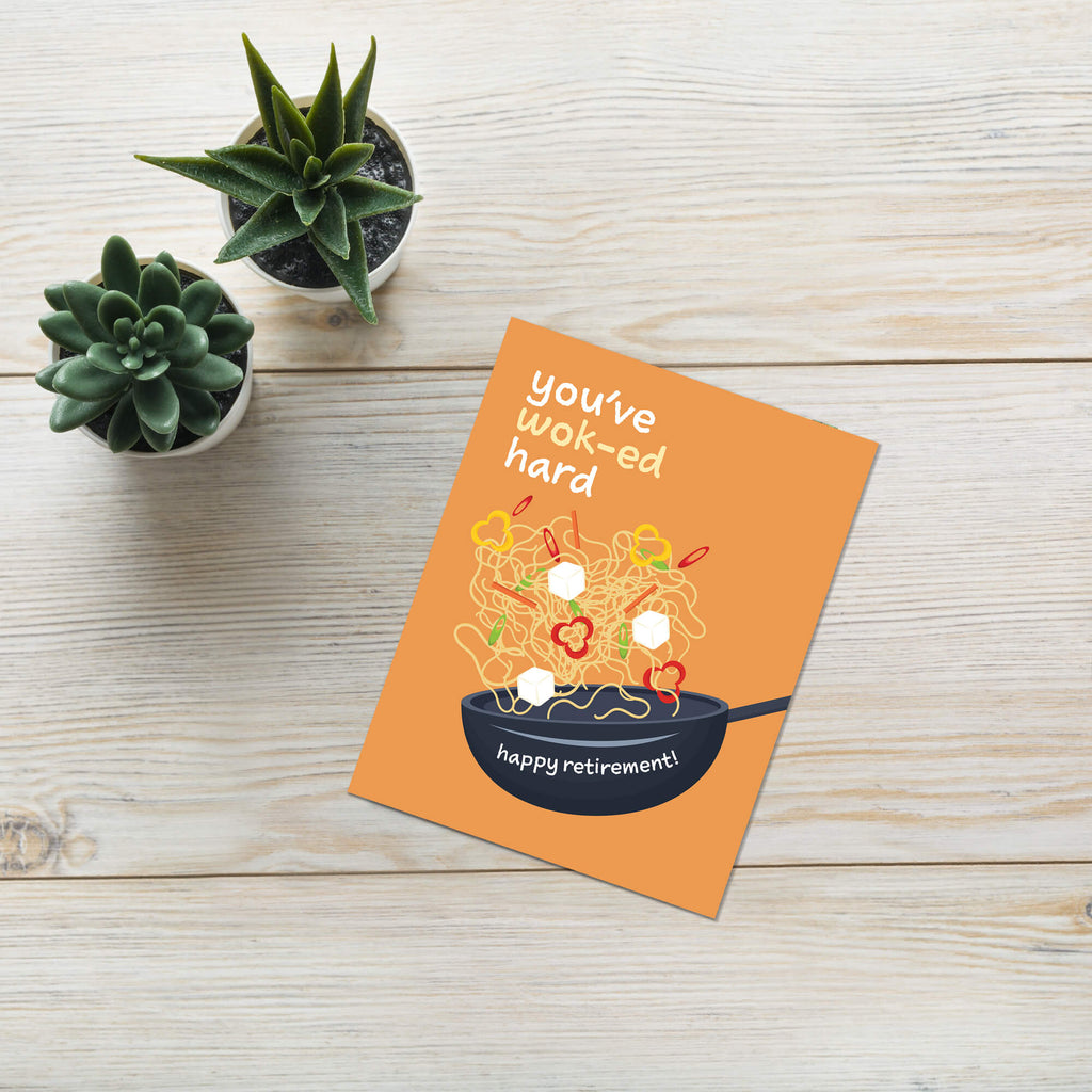 retirement card with a wok and noodles design, text 'you've wok-ed hard happy retirement!', on an orange background.