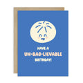 Blue birthday card with a cartoon character and text on a white background