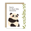 Greeting card with a panda illustration and text 'You're Un-Bear-Ably Awesome' on a white background.