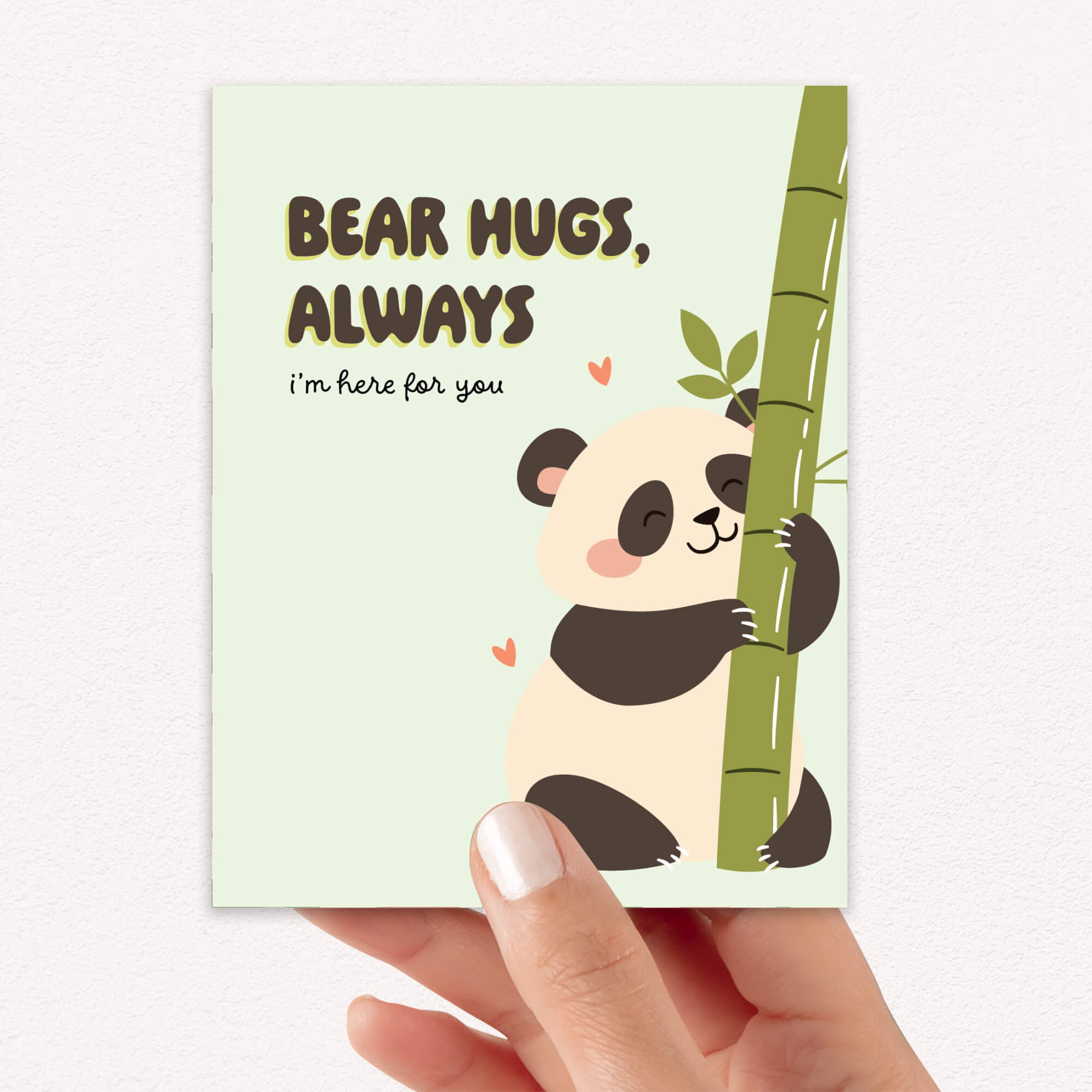 Card with a panda illustration and text 'Bear hugs, always. I'm here for you.' held by a hand.