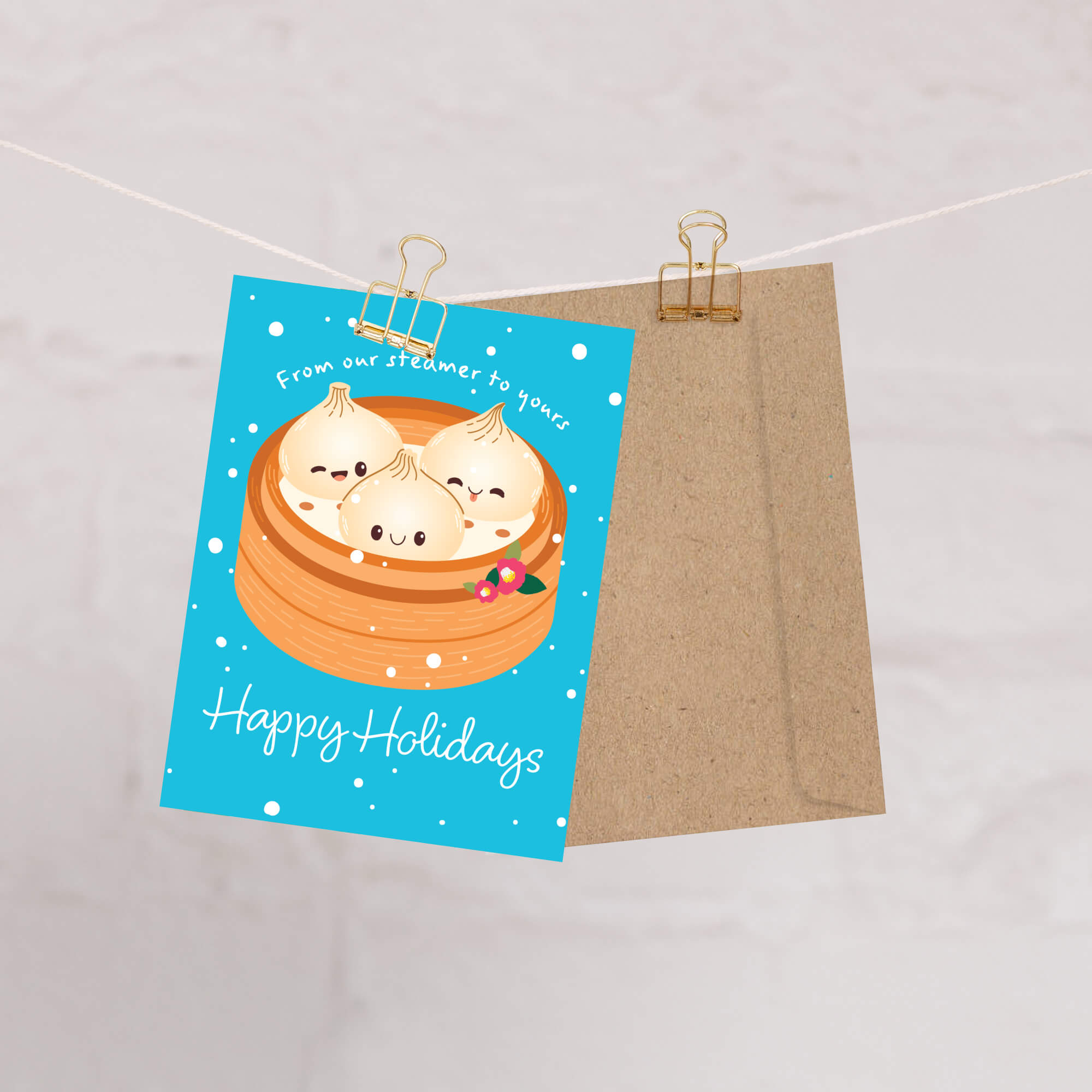 cute christmas greeting card with Three cute soup dumplings in bamboo steamer on teal snow with “From our steamer to yours. Happy Holidays.”