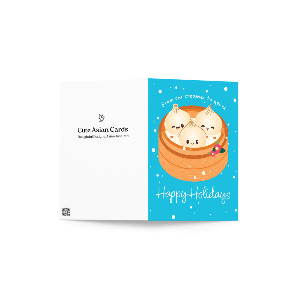 cute christmas greeting card with Three cute soup dumplings in bamboo steamer on teal snow with “From our steamer to yours. Happy Holidays.”