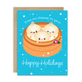 cute christmas greeting card with Three cute soup dumplings in bamboo steamer on teal snow with “From our steamer to yours. Happy Holidays.”