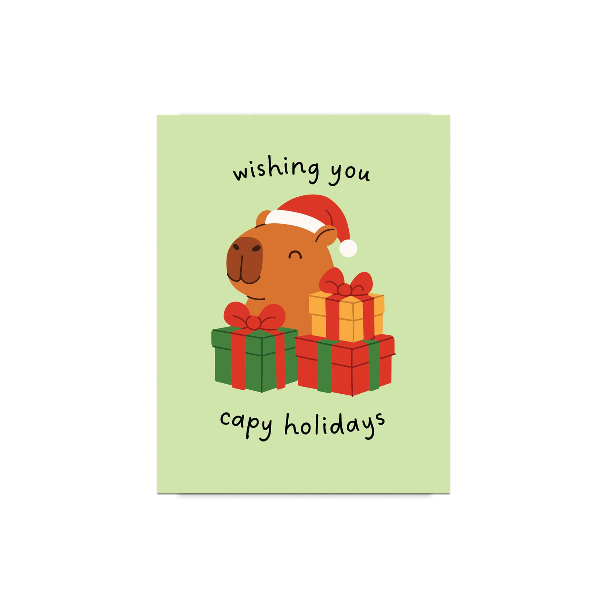 cute unique Christmas card with a capybara wearing a Santa hat and surrounded by presents on a light green background with text pun: wishing you capy holidays