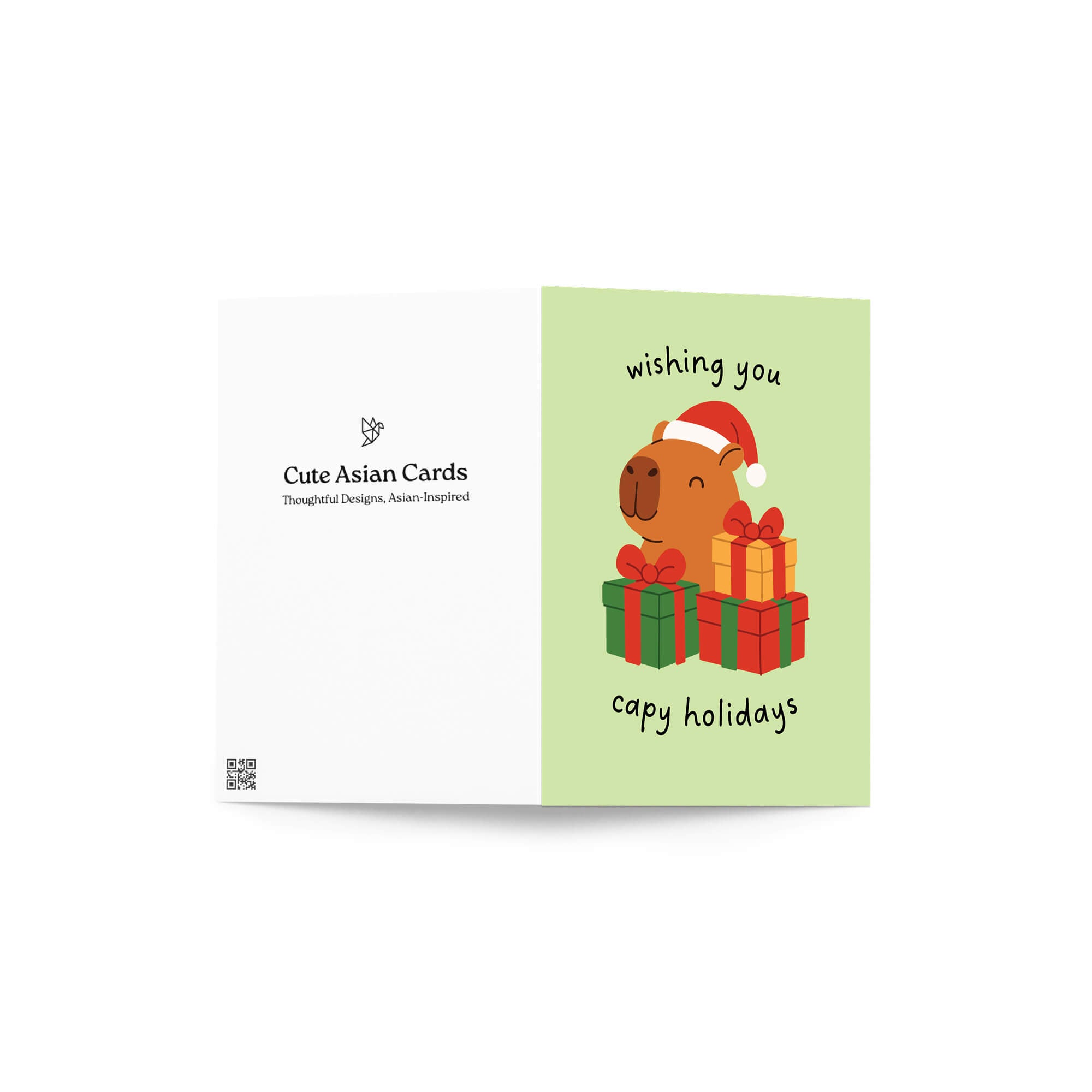 cute unique Christmas card with a capybara wearing a Santa hat and surrounded by presents on a light green background with text pun: wishing you capy holidays