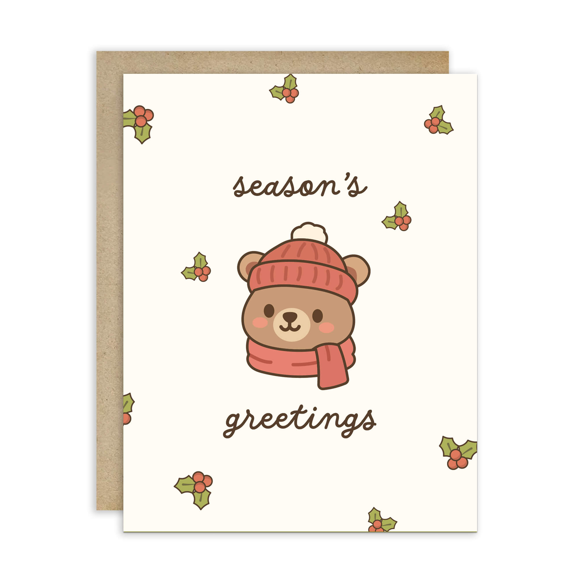 cute Christmas card with a bear wearing a pink hat and scarf, surrounded by holly leaves and berries with text: season's greetings