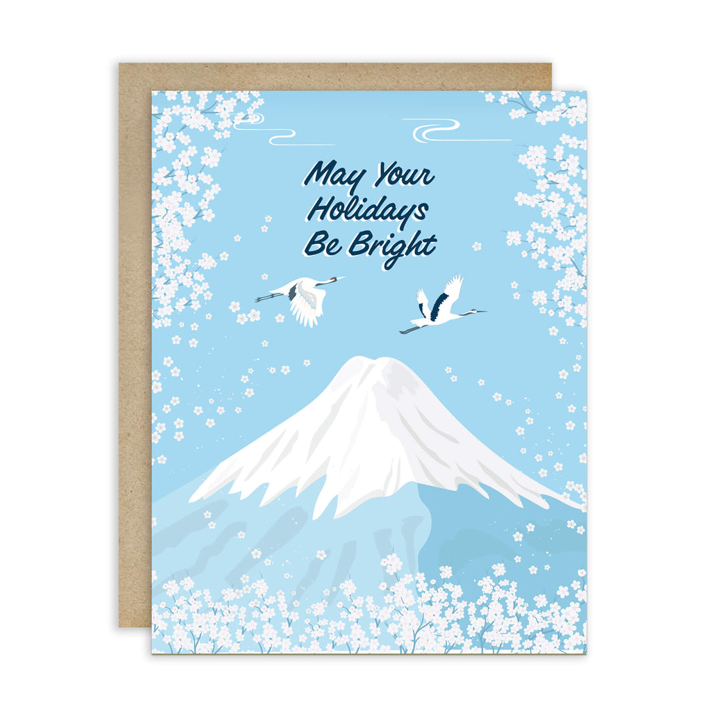japanese christmas card with a winter snowy Mount Fuji with cranes and white cherry blossoms; text “May Your Holidays Be Bright.”