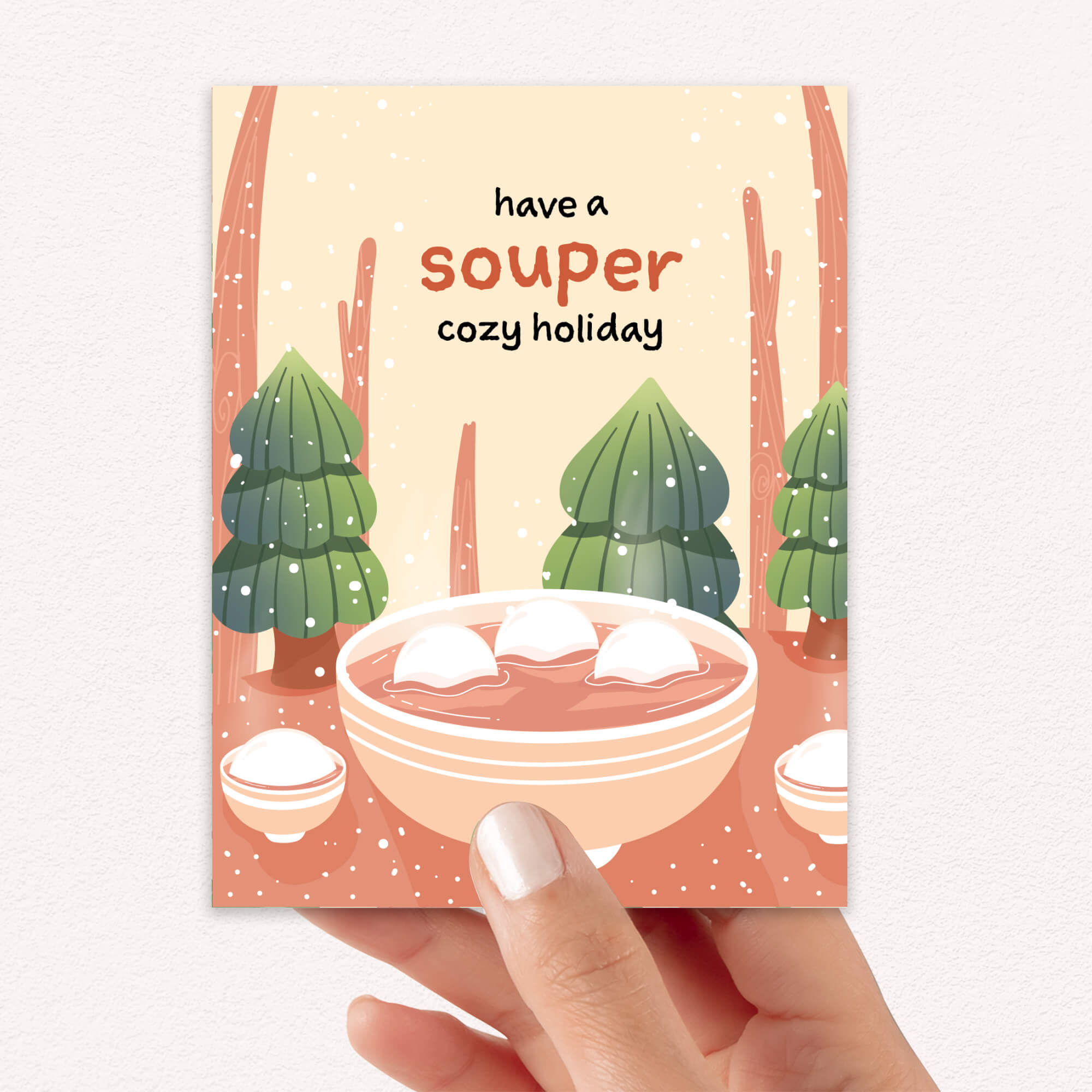 unique holiday Greeting card with a bowl of soup and winter scene, text 'have a souper cozy holiday'. 
