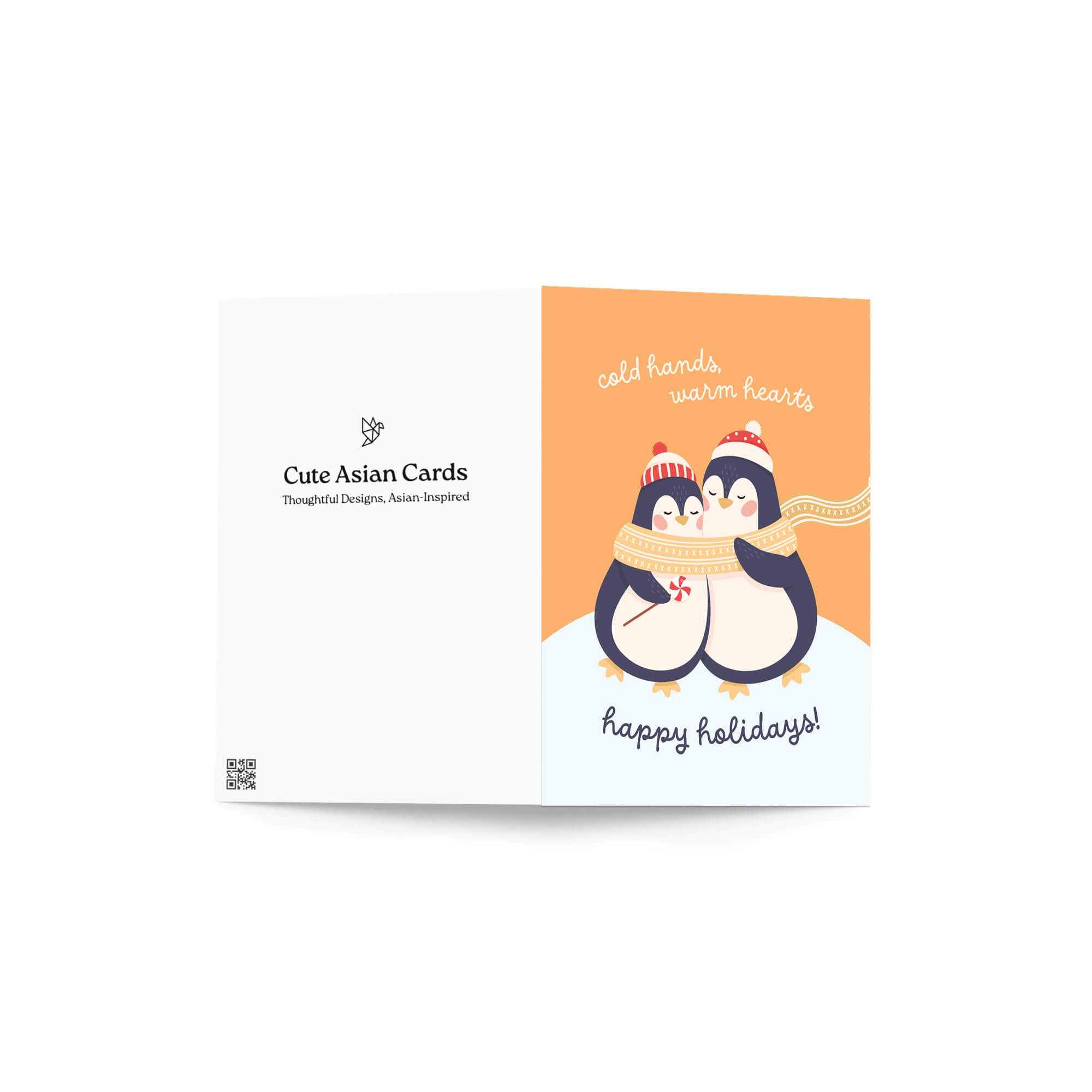 unique holiday card with two penguins hugging, wearing scarves and hats, on an orange background with text "Two penguins in knit hats sharing a scarf; text “cold hands, warm hearts — happy holidays!”"