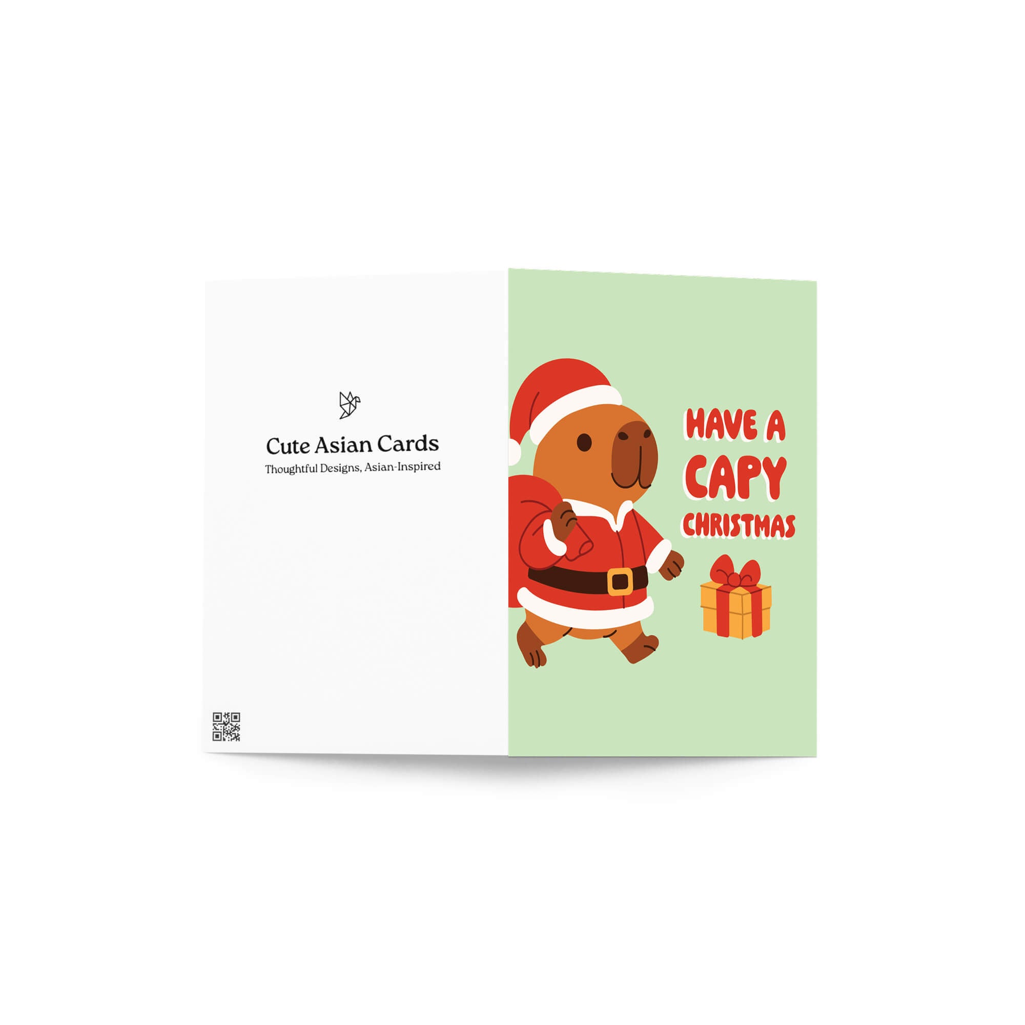 cute unique Christmas card with a capybara in a Santa outfit and text 'Have a Capy Christmas' on a light green background.