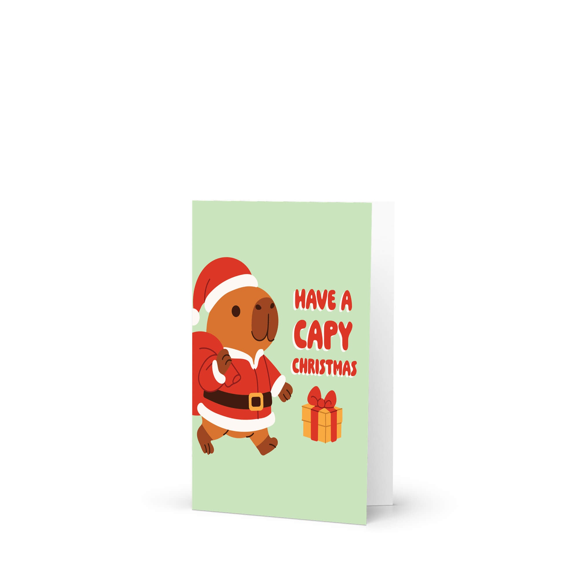 cute unique Christmas card with a capybara in a Santa outfit and text 'Have a Capy Christmas' on a light green background.