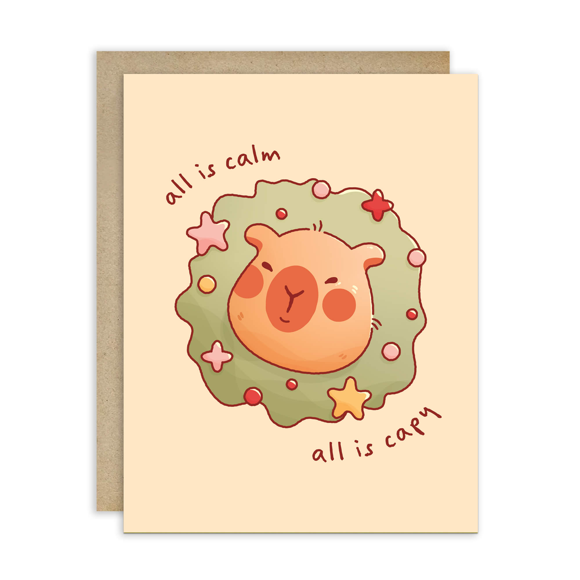 cute christmas card with a Capybara nestled in green holiday wreath with stars, text “all is calm, all is capy.”