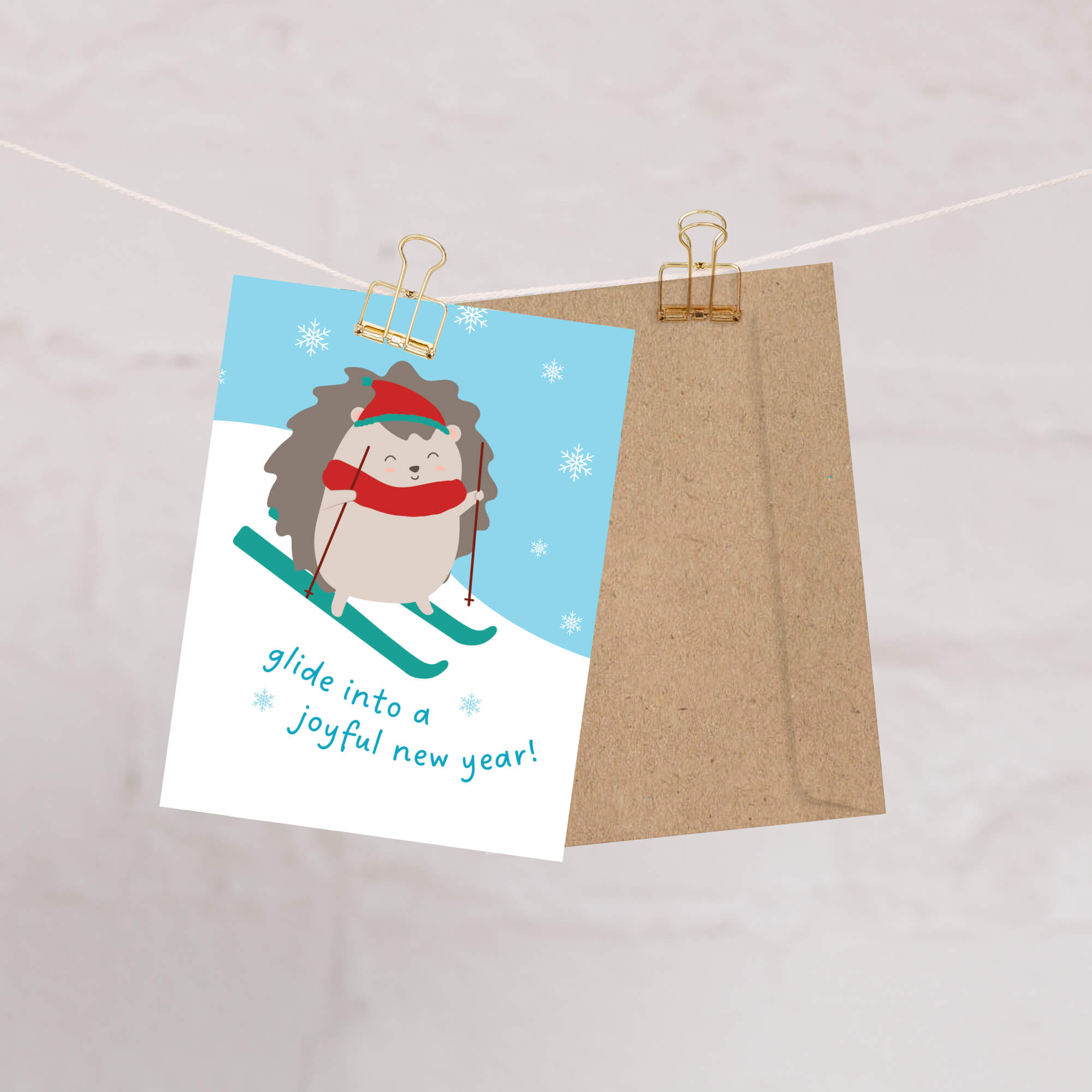 cute unique christmas Greeting card with a hedgehog skiing and text 'glide into a joyful new year!' on a snowy background.