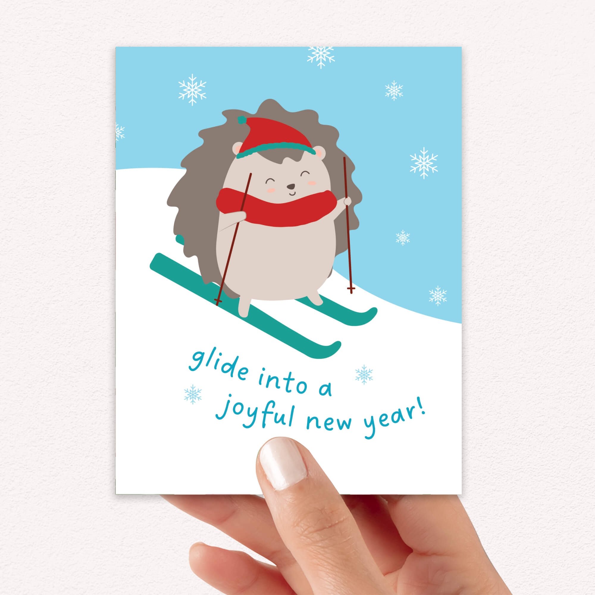 cute unique christmas Greeting card with a hedgehog skiing and text 'glide into a joyful new year!' on a snowy background.