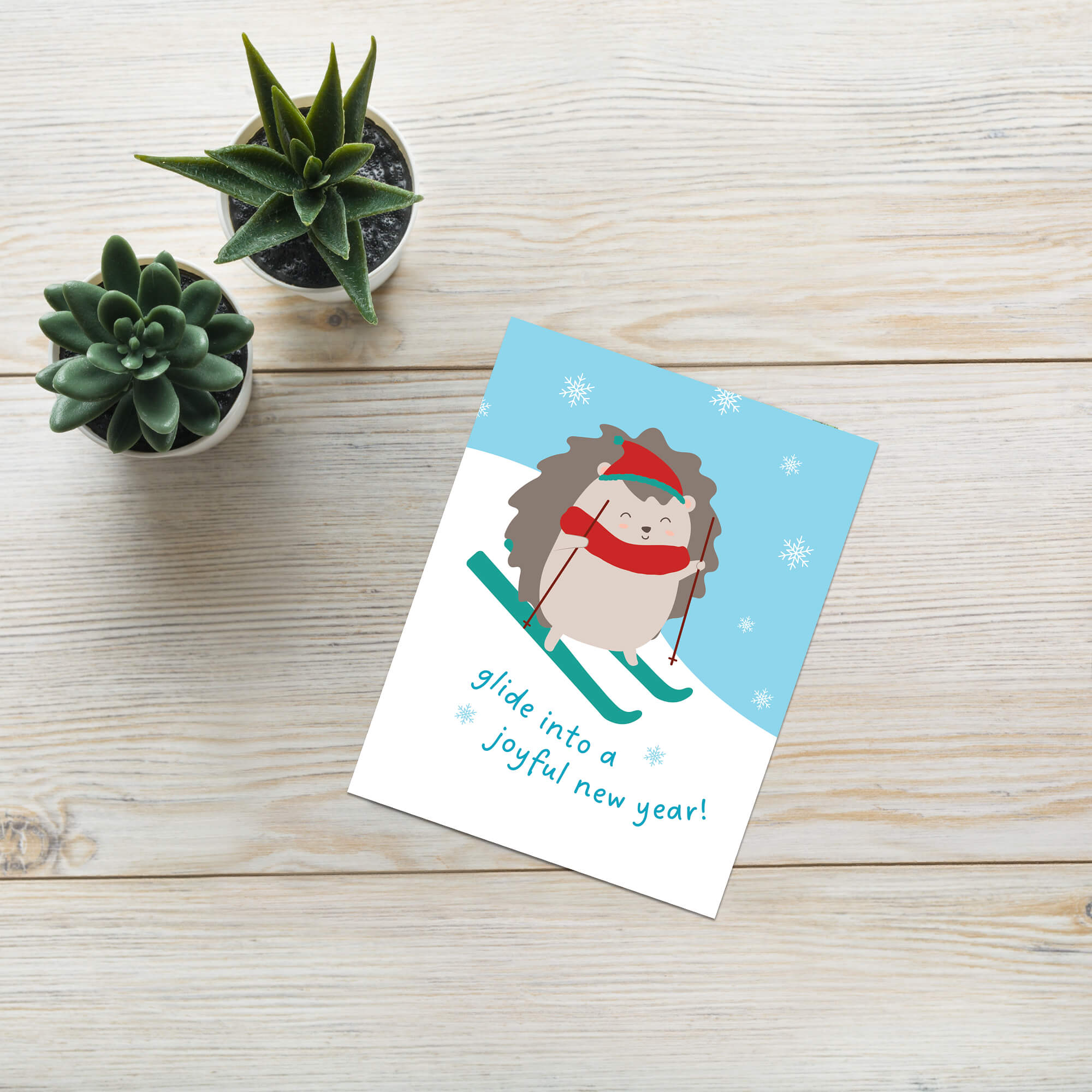 cute unique christmas Greeting card with a hedgehog skiing and text 'glide into a joyful new year!' on a snowy background.