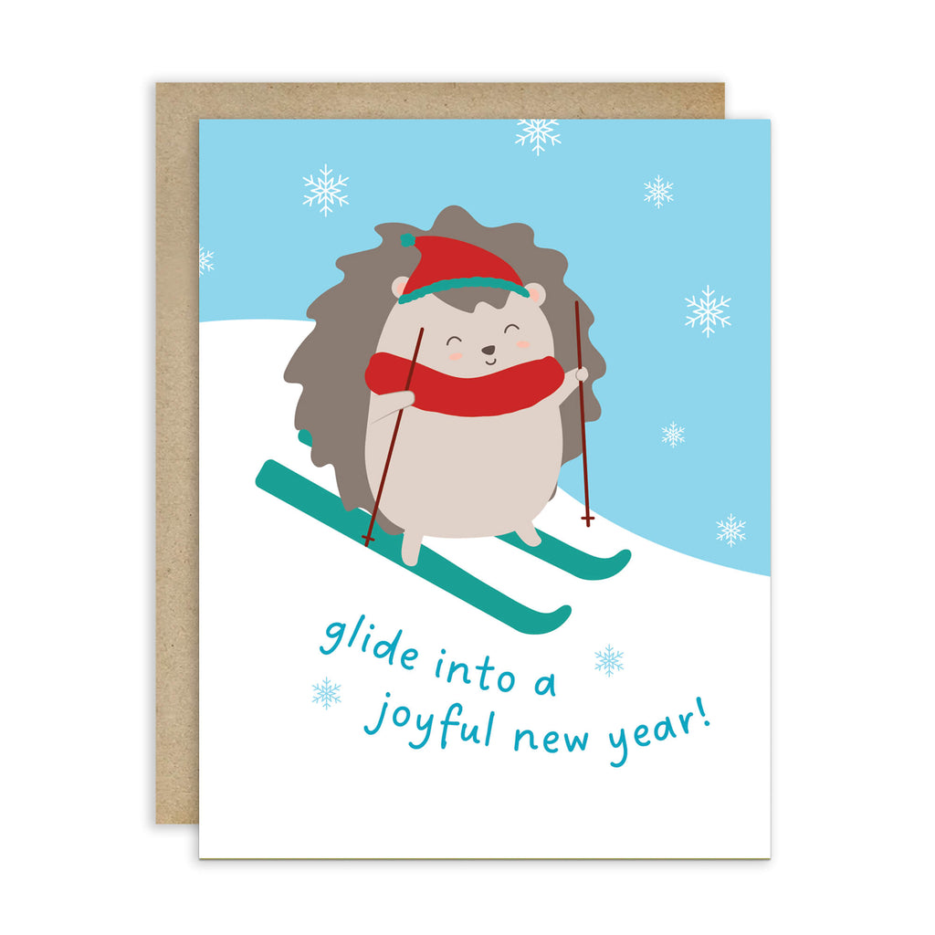 cute unique christmas Greeting card with a hedgehog skiing and text 'glide into a joyful new year!' on a snowy background.