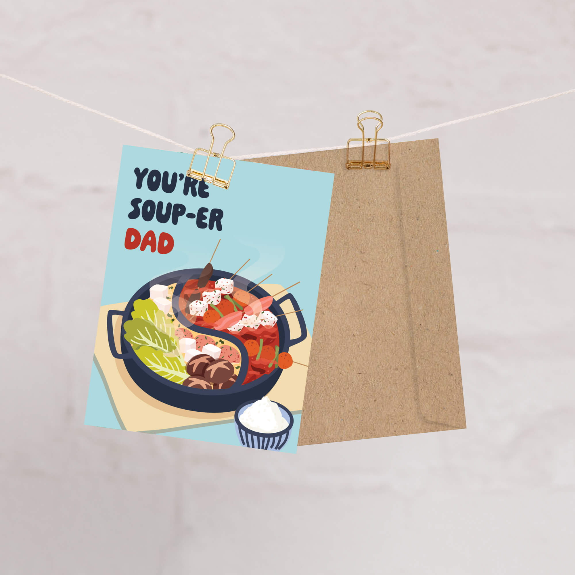 funny father's day card with hot pot soup and 'You're Soup-er Dad' text on a light blue background.