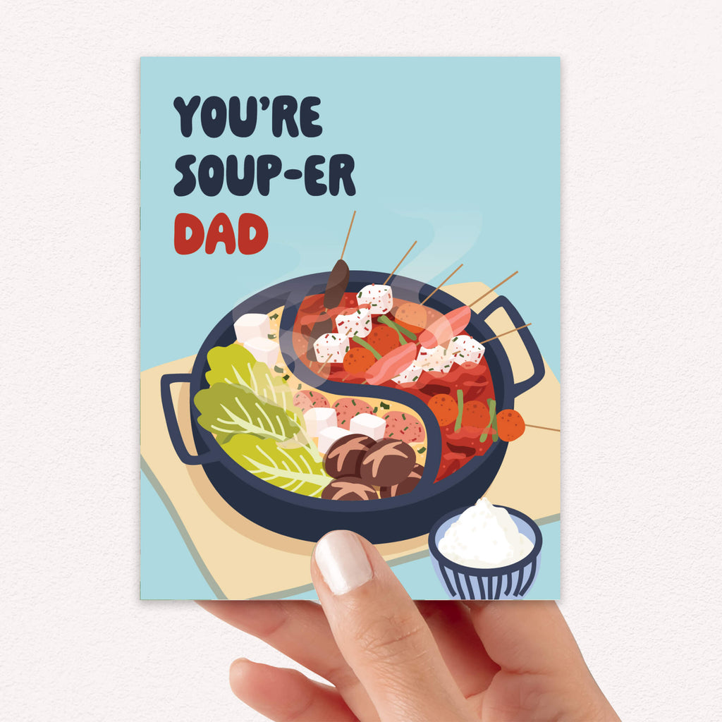 funny father's day card with hot pot soup and 'You're Soup-er Dad' text on a light blue background.