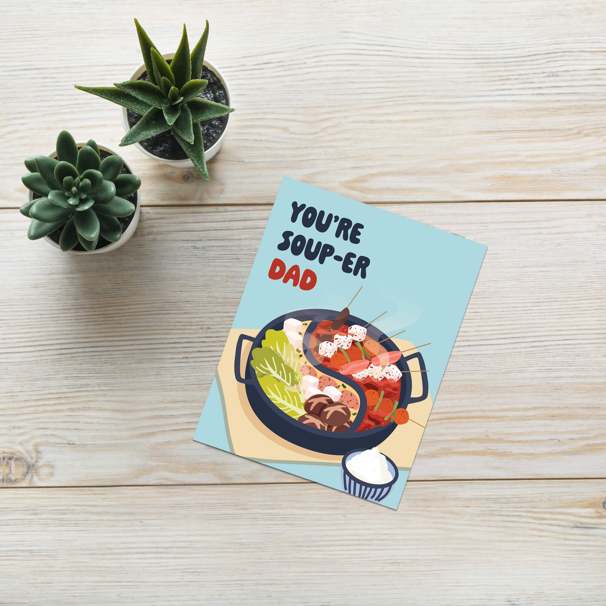 funny father's day card with hot pot soup and 'You're Soup-er Dad' text on a light blue background.