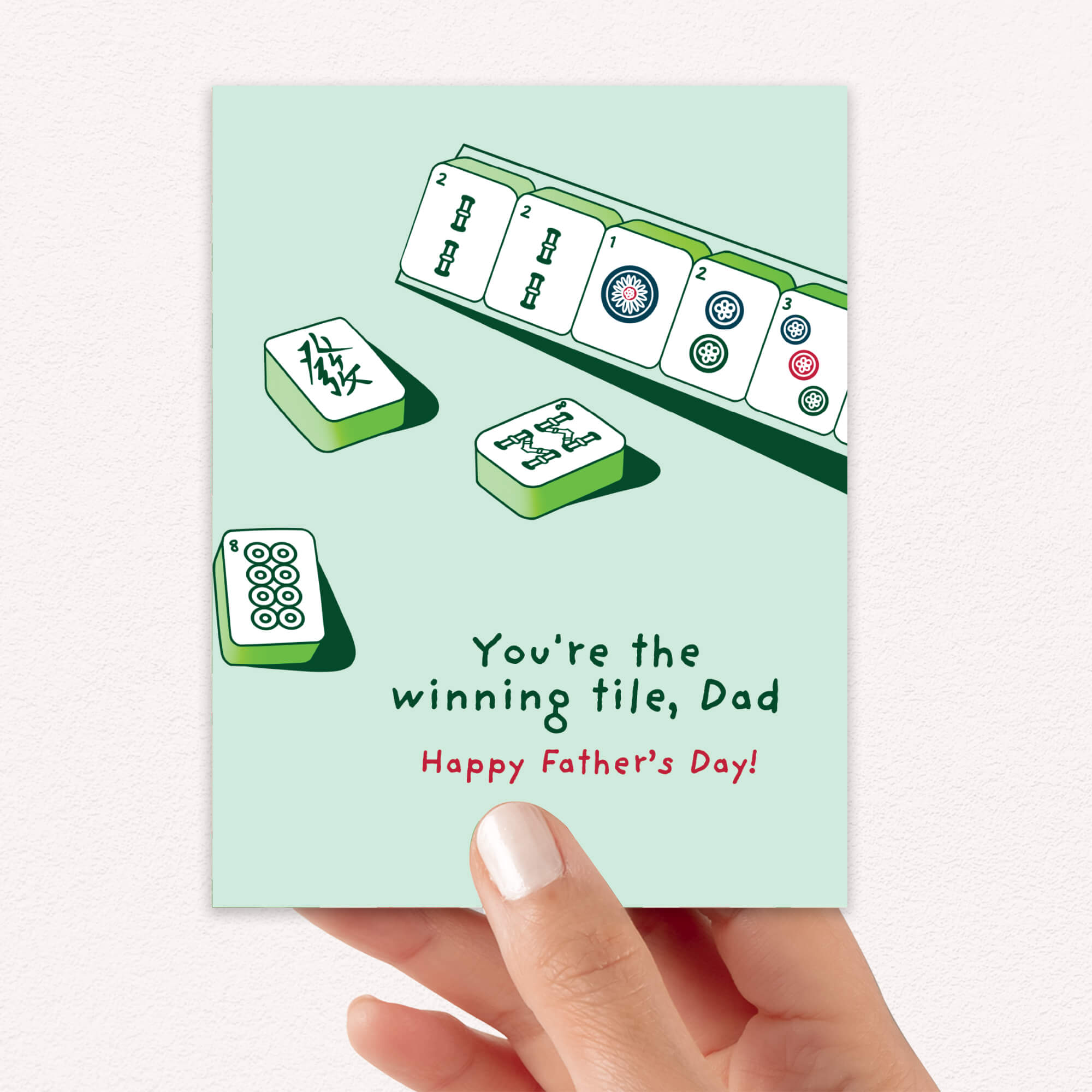 Father's Day card with Mahjong tiles and text "youre the winning tile dad" on a light green background