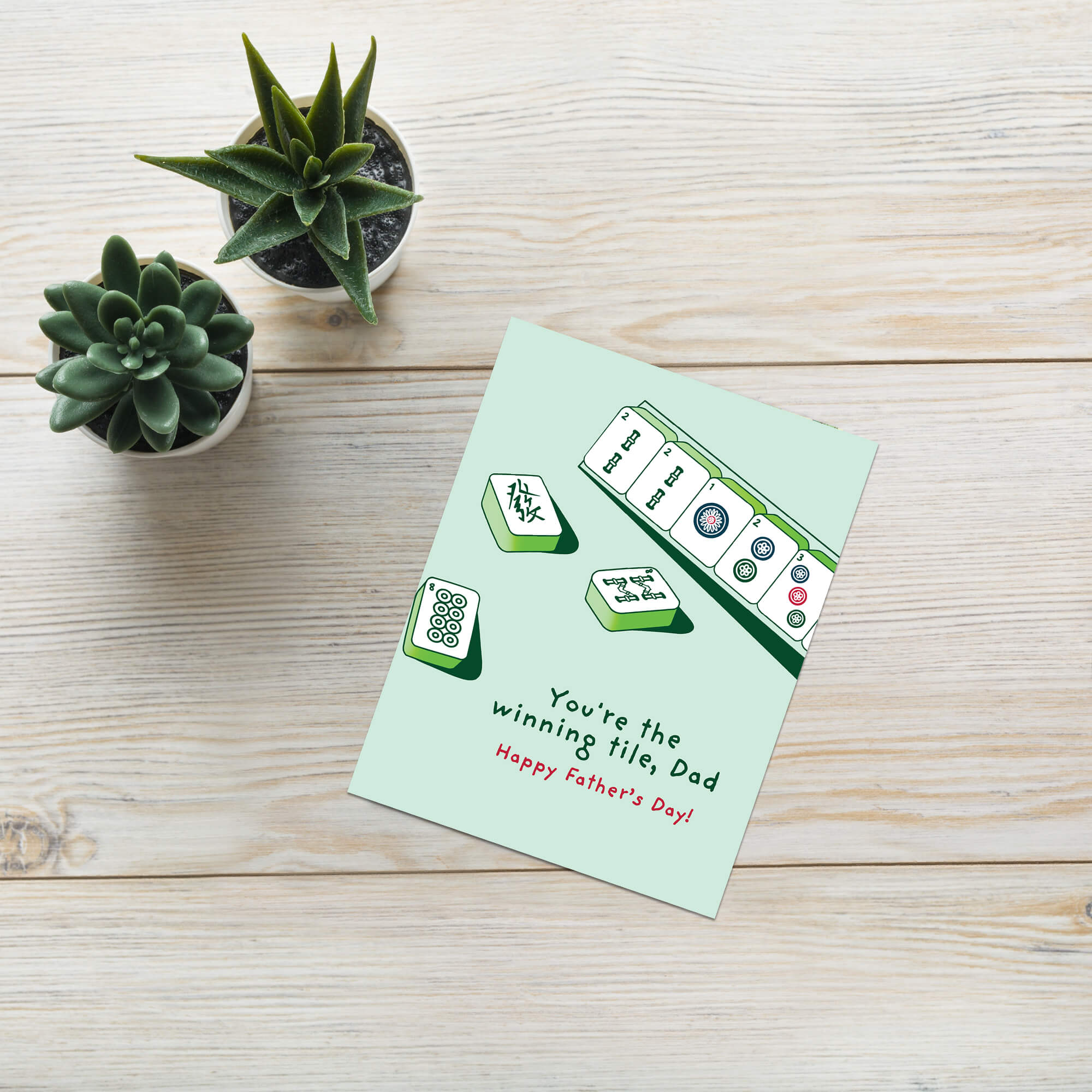 Father's Day card with Mahjong tiles and text "youre the winning tile dad" on a light green background