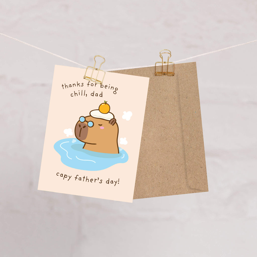 funny Father's Day card with a cute capybara animal in water and text 'thanks for being chill, dad capy father's day!' on a beige background.