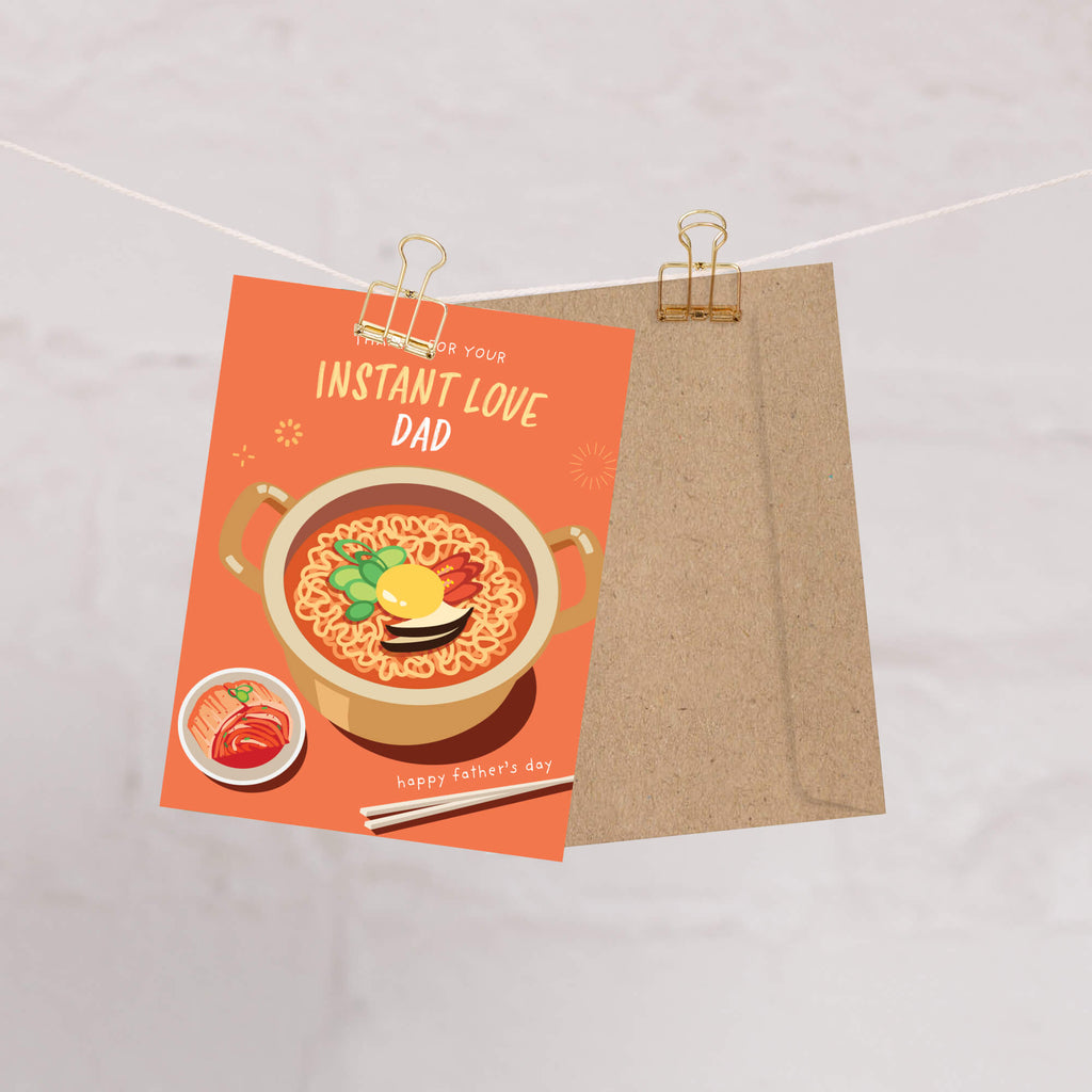 funny father's day card with a pot of korean instant noodles and text 'Thanks for your instant love dad' on an orange background.