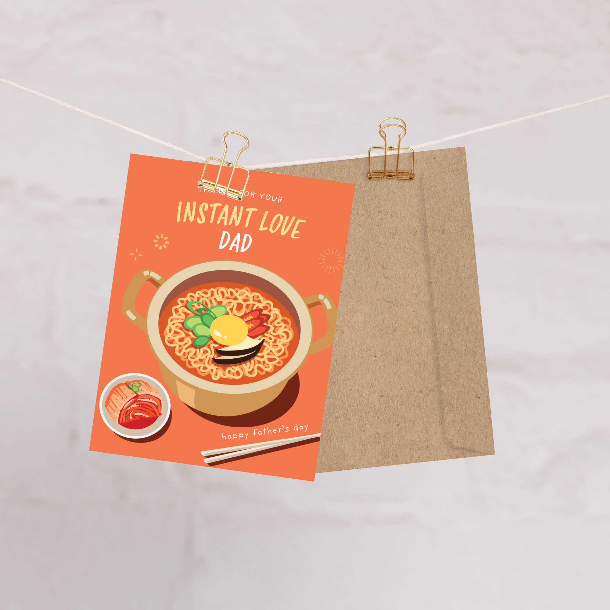 funny father's day card with a pot of korean instant noodles and text 'Thanks for your instant love dad' on an orange background.