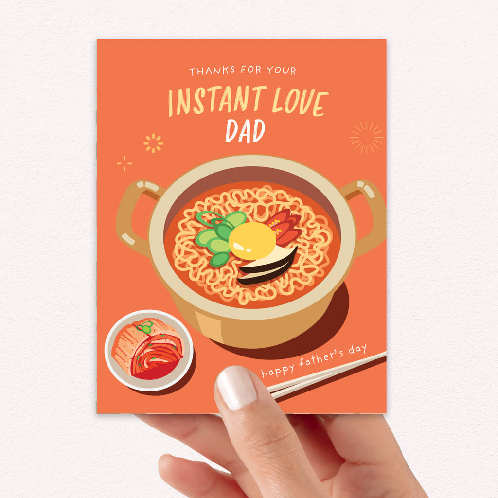 funny father's day card with a pot of korean instant noodles and text 'Thanks for your instant love dad' on an orange background.